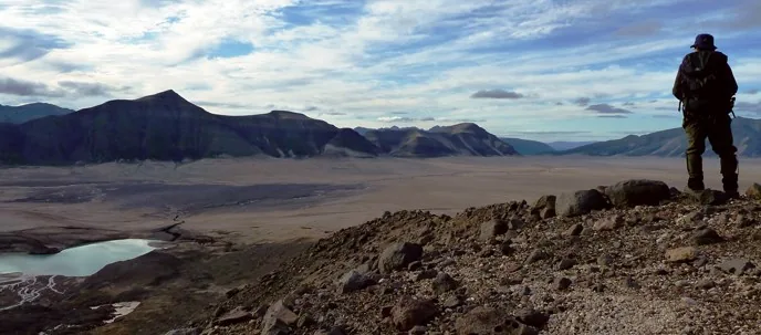 Hiker overlooking the Valley of Ten Thousand Smokes in Katmai