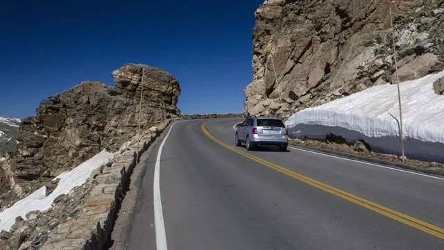Vehicle on Trail Ridge Road near Rock Cut